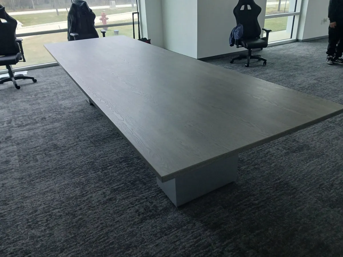 14-foot gray conference table awaiting chairs