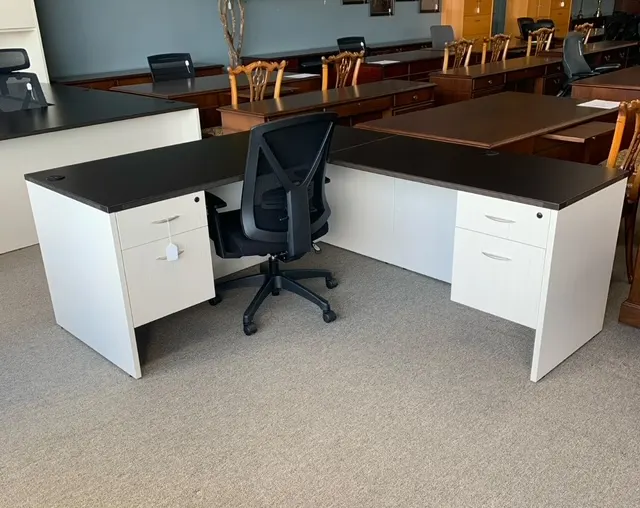 Two-tone L-shaped desk with black top and white base