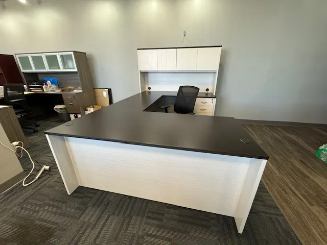 Private office furnished with two-tone U-shaped desk and hutch