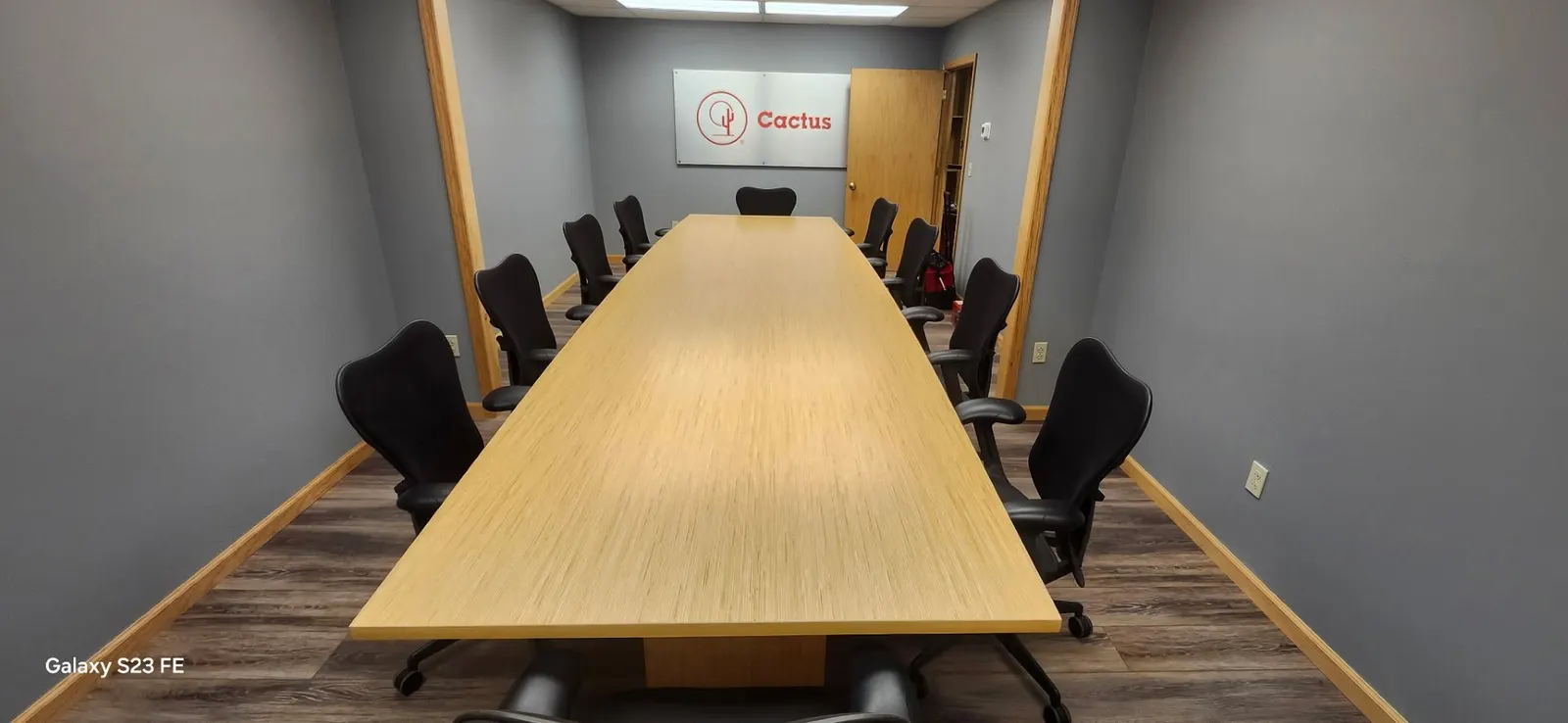Custom 20-foot conference table in a company boardroom