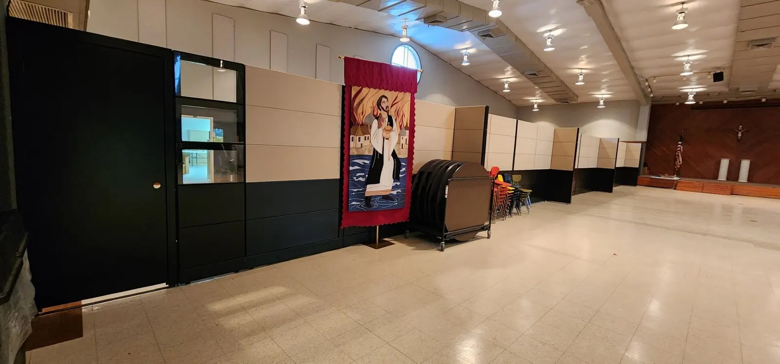 Full-height wall panels staged on carts during a New Space installation