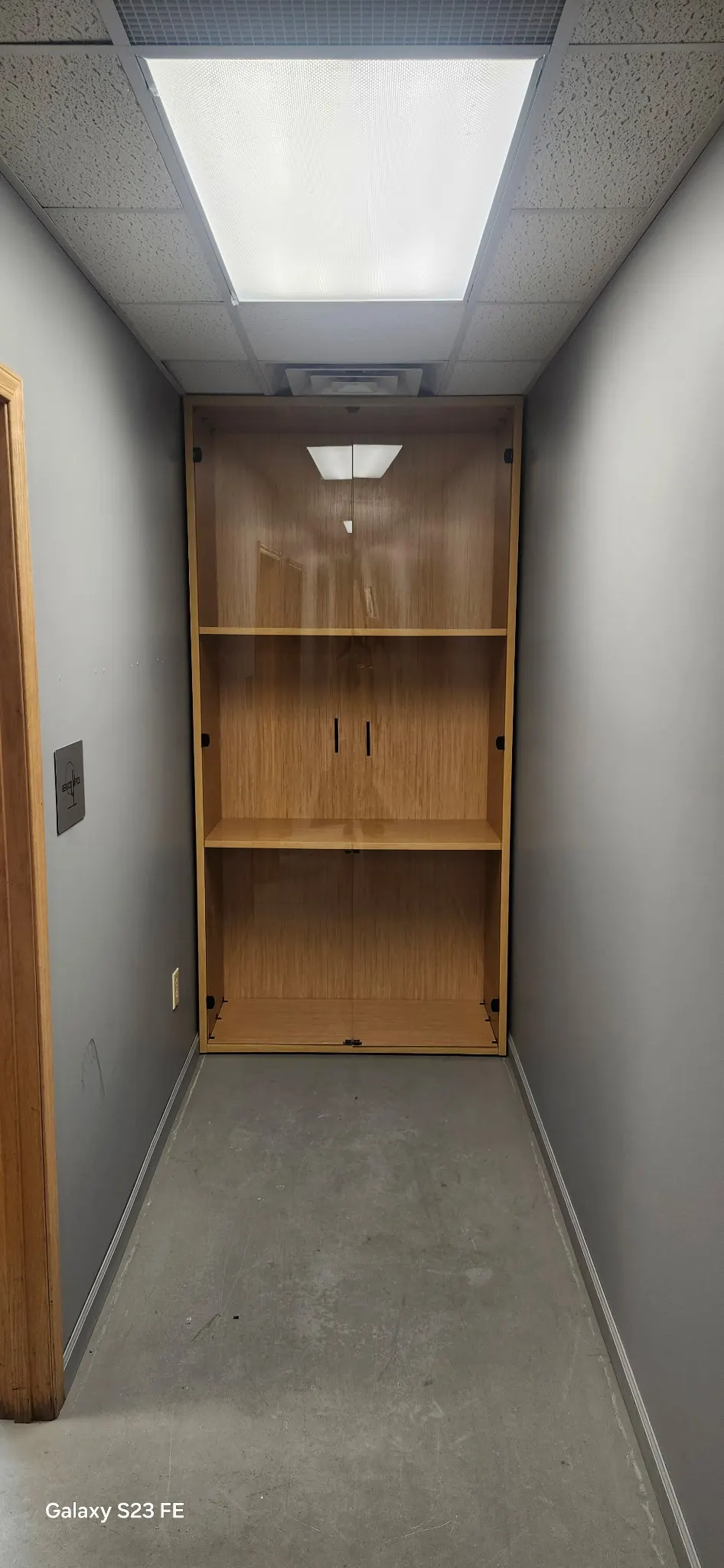 Custom-built wood bookcase and storage cabinet