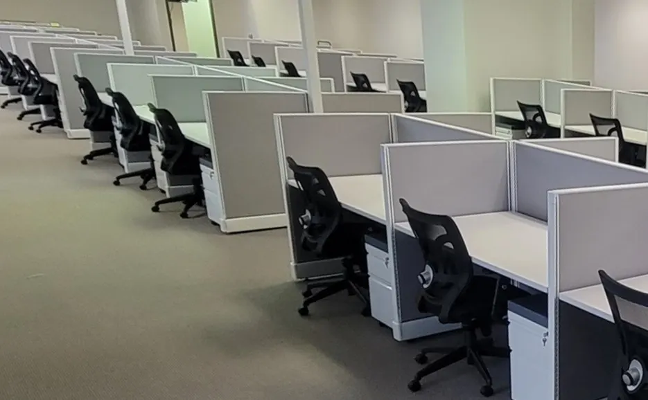 Rows of refurbished Herman Miller AO2 workstations with task seating installed in a Houston office