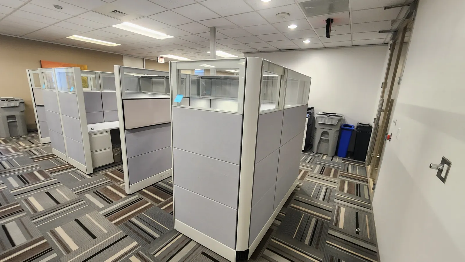 Herman Miller Ethospace workstations with framed glass stack panels